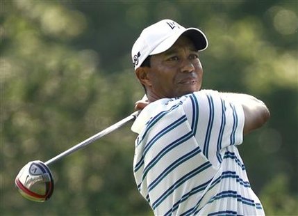 Tiger Woods of the U.S. watches his tee shot on the 15th hole during the second round of the Memorial Tournament at Muirfield Village Golf Club in Dublin, Ohio, June 4, 2010. REUTERS/Matt Sullivan
Tiger Woods of the U.S. watches his tee shot on the 15th hole during the second round of the Memorial Tournament at Muirfield Village Golf Club in Dublin, Ohio, June 4, 2010. REUTERS/Matt Sullivan
