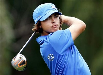 Rickie Fowler of the U.S. watches his tee shot on the ninth hole during the third round of the Memorial golf tournament in Dublin, Ohio, June 5, 2010. REUTERS/Matt Sullivan
Rickie Fowler of the U.S. watches his tee shot on the ninth hole during the third round of the Memorial golf tournament in Dublin, Ohio, June 5, 2010. REUTERS/Matt Sullivan