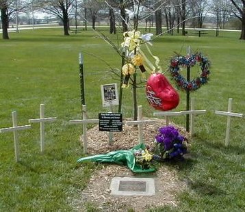 A memorial to 7 people killed in the crash of a traveling sales crew van in Janesville, Wis.  