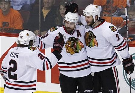 Chicago Blackhawks Patrick Sharp (C) celebrates his goal with teammates Duncan Keith (L) and Brent Seabrook during the second period in Game 6 of the NHL Stanley Cup final hockey series against the Philadelphia Flyers in Philadelphia, June 9, 2010. REUTERS/Jim Young
Chicago Blackhawks Patrick Sharp (C) celebrates his goal with teammates Duncan Keith (L) and Brent Seabrook during the second period in Game 6 of the NHL Stanley Cup final hockey series against the Philadelphia Flyers in Philadelphia, June 9, 2010. REUTERS/Jim Young