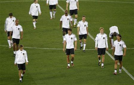 
German players walk across the Moses Mabhida stadium during a training session in Durban June 12, 2010. Germany will play Australia in their World Cup 2010 soccer match on June 13. REUTERS/Rogan Ward

