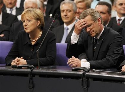 German Chancellor Angela Merkel and Christian Democratic Union party (CDU) candidate Lower Saxony state premier Christian Wulff (R) wait to hear the result of the German presidential election, at the Reichstag in Berlin June 30, 2010. REUTERS/Wolfgang Rattay
German Chancellor Angela Merkel and Christian Democratic Union party (CDU) candidate Lower Saxony state premier Christian Wulff (R) wait to hear the result of the German presidential election, at the Reichstag in Berlin June 30, 2010. REUTERS/Wolfgang Rattay