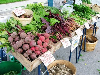 Produce at a farmers market stand.