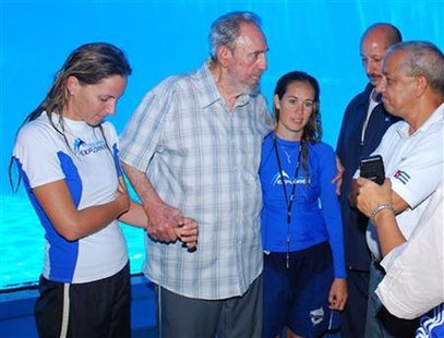 Former Cuban leader Fidel Castro (2nd L) stands with trainers of Havana's National Aquarium during a visit July 15, 2010. Castro has been seen only in occasional photographs and videos since he underwent emergency intestinal surgery in July 2006 and ceded power provisionally to his younger brother, Raul Castro. He resigned in February 2008 and Raul Castro was officially elected president by the National Assembly. REUTERS/Revolution Studios
Former Cuban leader Fidel Castro (2nd L) stands with trainers of Havana's National Aquarium during a visit July 15, 2010. Castro has been seen only in occasional photographs and videos since he underwent emergency intestinal surgery in July 2006 and ceded power provisionally to his younger brother, Raul Castro. He resigned in February 2008 and Raul Castro was officially elected president by the National Assembly. REUTERS/Revolution Studios