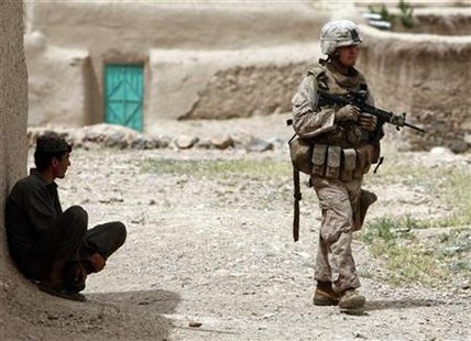 
A U.S. marine patrols in a village in Golestan district, Farah province May 10, 2009. REUTERS/Goran Tomasevic
