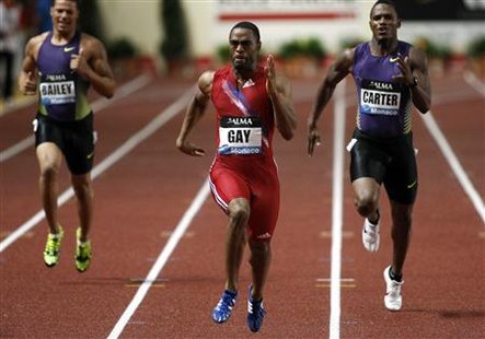 Tyson Gay (C) of the U.S. competes during the men's 200m event at the Herculis Athletics Meeting at Louis II stadium in Monaco July 22, 2010. REUTERS/Sebastien Nogier
Tyson Gay (C) of the U.S. competes during the men's 200m event at the Herculis Athletics Meeting at Louis II stadium in Monaco July 22, 2010. REUTERS/Sebastien Nogier