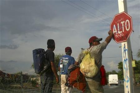 Men wait near a train station to stow away to Mexico City after failing to enter illegally into the U.S. state of Arizona, in Hermosillo, in the Mexican state of Sonora, July 22, 2010. REUTERS/Alonso Castillo
Men wait near a train station to stow away to Mexico City after failing to enter illegally into the U.S. state of Arizona, in Hermosillo, in the Mexican state of Sonora, July 22, 2010. REUTERS/Alonso Castillo