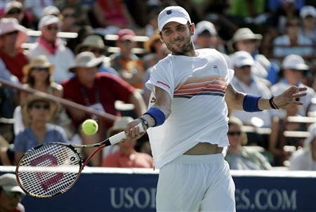 
Mardy Fish of the U.S. returns a volley to compatriot John Isner during the finals of the Atlanta Tennis Championships in Johns Creek, Georgia July 25, 2010. REUTERS/Tami Chappell
