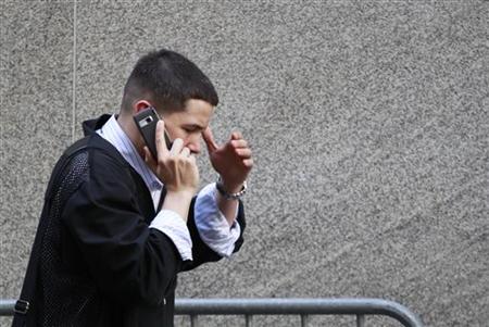 
A trader talks on his mobile phone outside of the New York Stock Exchange in New York May 6, 2010. REUTERS/Lucas Jackson
