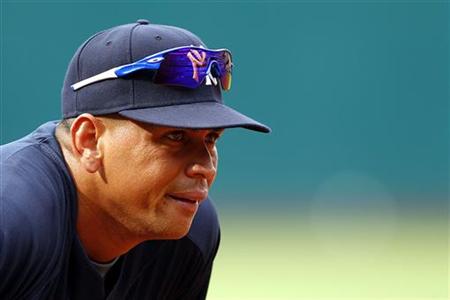 
Alex Rodriguez of the New York Yankees looks on during the infield practice before their MLB American League game against the Cleveland Indians in Cleveland, Ohio July 26, 2010. REUTERS/Aaron Josefczyk
