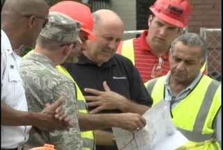 Governor Doyle surveys damage from flooding in Milwaukee County. (courtesy of FOX 11).