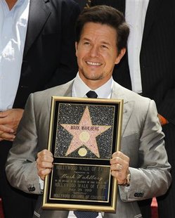 
Actor Mark Wahlberg poses with his plaque after his star was unveiled on the Hollywood Walk of Fame in Hollywood, California, July 29, 2010. Wahlberg's star is the 2,414th star on the Walk of Fame. REUTERS/Danny Moloshok
