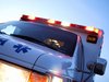 An ambulance leaving the scene of an accident.