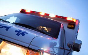 An ambulance leaving the scene of an accident. An ambulance leaving the scene of an accident.