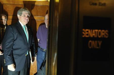 
Senator Ben Nelson (D-NE) (L) is trailed by reporters in Washington in this December 19, 2009 file photo. REUTERS/Jonathan Ernst
