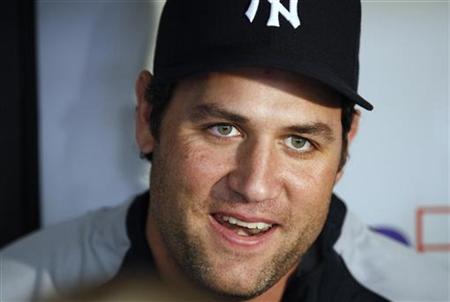 New York Yankees' Lance Berkman talks to the media for the first time since his trade from the Houston Astros before the Yankee's MLB American League baseball game in St. Petersburg, Florida July 31, 2010. REUTERS/Scott Audette
New York Yankees' Lance Berkman talks to the media for the first time since his trade from the Houston Astros before the Yankee's MLB American League baseball game in St. Petersburg, Florida July 31, 2010. REUTERS/Scott Audette