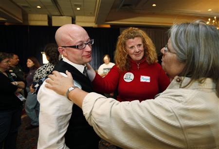 Gay marriage supporters Barb Wood (R) and Margaret O'Connell (C), comfort Tim Diehl as they wait for election results at the No on 1/Protect Maine Equality election night rally in Portland, Maine November 4, 2009. The group is working to prevent the repeal of Maine's gay marriage law, which was adopted last spring by Maine's legislature. REUTERS/Joel Page
Gay marriage supporters Barb Wood (R) and Margaret O'Connell (C), comfort Tim Diehl as they wait for election results at the No on 1/Protect Maine Equality election night rally in Portland, Maine November 4, 2009. The group is working to prevent the repeal of Maine's gay marriage law, which was adopted last spring by Maine's legislature. REUTERS/Joel Page