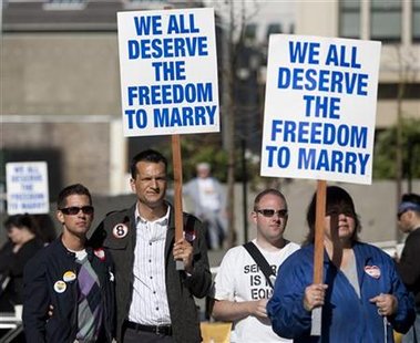 People rally outside a federal court house in support of California over turning a ban on same sex marriage in San Francisco, California, June 16, 2010. REUTERS/Kim White
People rally outside a federal court house in support of California over turning a ban on same sex marriage in San Francisco, California, June 16, 2010. REUTERS/Kim White