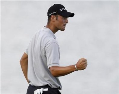 Martin Kaymer of Germany reacts to sinking his birdie putt on the 17th hole on the second hole of a playoff during the final round of the 92nd PGA Golf Championship at Whistling Straits, in Kohler, Wisconsin, August 15, 2010. Courtesy of Reuters: Matt Sullivan.