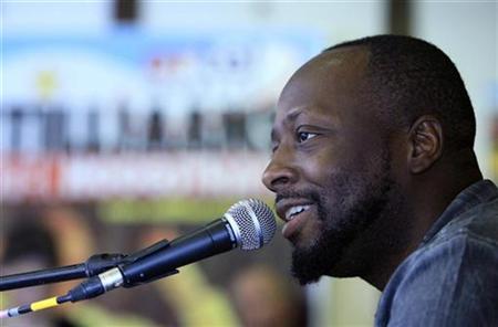 Haitian singer Wyclef Jean, a candidate for the next presidential election in Haiti, attends a news conference before his concert at the Antilliaanse Feesten music festival in Hoogstraten, August 13, 2010. REUTERS/Sebastien Pirlet
Haitian singer Wyclef Jean, a candidate for the next presidential election in Haiti, attends a news conference before his concert at the Antilliaanse Feesten music festival in Hoogstraten, August 13, 2010. REUTERS/Sebastien Pirlet