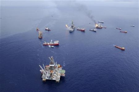 Crews aboard vessels around the drillship Discoverer Enterprise continue operations to minimize the impact from the BP Deepwater Horizon oil spill in the Gulf of Mexico in this June 28, 2010 handout photograph. REUTERS/Walter Shinn/U.S. Coast Guard/Handout
Crews aboard vessels around the drillship Discoverer Enterprise continue operations to minimize the impact from the BP Deepwater Horizon oil spill in the Gulf of Mexico in this June 28, 2010 handout photograph. REUTERS/Walter Shinn/U.S. Coast Guard/Handout