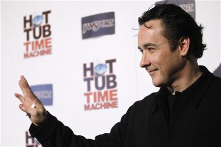Cast member John Cusack waves at the premiere of "Hot Tub Time Machine" in Hollywood, California March 17, 2010. REUTERS/Mario Anzuoni
Cast member John Cusack waves at the premiere of "Hot Tub Time Machine" in Hollywood, California March 17, 2010. REUTERS/Mario Anzuoni