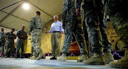 
Defense Secretary Robert Gates greets and presents tokens to troops from the 4th Infantry Brigade, 3rd Infantry Division, during a visit to Camp Ramadi in Iraq September 1, 2010, a day after U.S. troops formally ended combat operations in the country. REUTERS/Jim Watson/Pool
