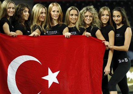
Cheerleaders pose with Turkey's national flag during a rehearsal in Ankara September 1, 2010. The absence of scantily clad female cheerleaders at recent World Championship basketball matches involving host nation Turkey has raised eyebrows in the overwhelmingly Muslim but officially secular nation. Troupes of energetic cheerleaders have entertained the crowds at matches involving other teams in the tournament, but no dancers appeared during Turk