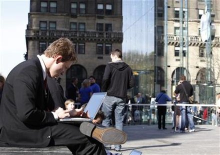 
A man works on his laptop in New York April 2, 2010. REUTERS/Jessica Rinaldi
