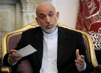 
Afghan President Hamid Karzai speaks during a meeting with U.S. senator John Kerry at the Presidential Palace in Kabul August 20, 2010. REUTERS/Yuri Cortez/Pool
