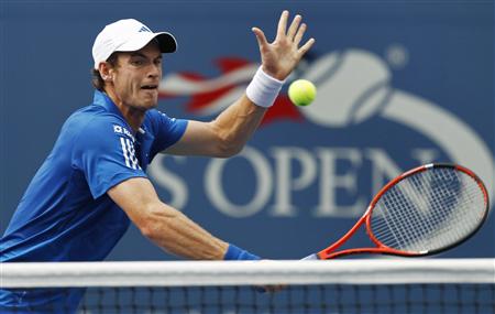 
Andy Murray of Britain comes to the net on a return to Dustin Brown of Jamaica during the U.S. Open tennis tournament in New York, September 3, 2010. REUTERS/Kevin Lamarque
