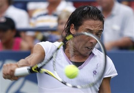
Francesca Schiavone of Italy hits a return to Alona Bondarenko of Ukraine during the U.S. Open tennis tournament in New York, September 3, 2010. REUTERS/Eduardo Munoz
