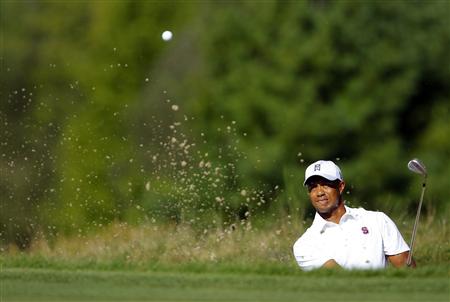 
Tiger Woods of the U.S. hits out of a sand trap on the eighth hole on day two of the second round of the Deutsche Bank Championship golf tournament in Norton, Massachusetts, September 4, 2010. REUTERS/Adam Hunger
