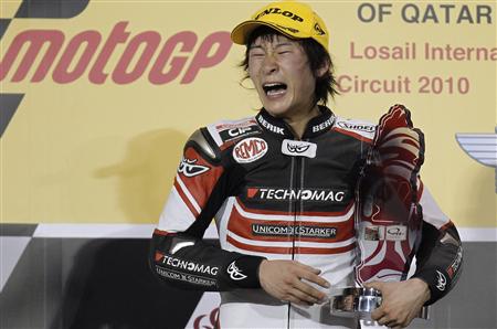 Suter rider Shoya Tomizawa of Japan holds up his trophy on the podium after winning the Moto2 race during the Qatar Grand Prix at the Losail international circuit in Doha in this April 11, 2010 file photo. REUTERS/Fadi Al-Assaad/Files
Suter rider Shoya Tomizawa of Japan holds up his trophy on the podium after winning the Moto2 race during the Qatar Grand Prix at the Losail international circuit in Doha in this April 11, 2010 file photo. REUTERS/Fadi Al-Assaad/Files