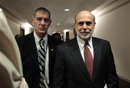 
Federal Reserve Board Chairman Ben Bernanke makes his way through the Dirkson building hallway after a Financial Crisis Inquiry Commission hearing on "Too Big to Fail: Expectations and Impact of Extraordinary Government Intervention and the role of Systemic Risk in the Financial Crisis," on Capitol Hill in Washington September 2, 2010. REUTERS/Molly Riley
