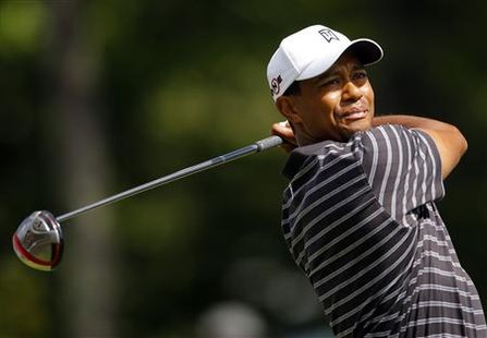 
Tiger Woods of the U.S. hits off the 12th tee during the third round of the Deutsche Bank Championship golf tournament in Norton, Massachusetts September 5, 2010. REUTERS/Brian Snyder
