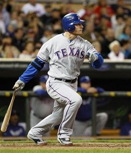 
Texas Rangers' Josh Hamilton watches his single to center field off Minnesota Twins starting pitcher Matt Fox during the second inning of their American League baseball game in Minneapolis, September 3, 2010. REUTERS/Eric Miller
