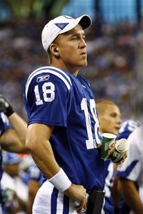 
Indianapolis Colts quarterback Peyton Manning watches from the sidelines during the second quarter of his team's NFL preseason game versus the Cincinnati Bengals in Indianapolis September 2, 2010. REUTERS/Brent Smith
