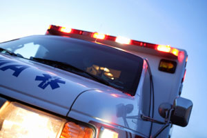 An ambulance leaving the scene of an accident. An ambulance leaving the scene of an accident.