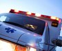 An ambulance leaving the scene of an accident.