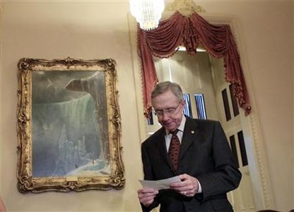 
U.S. Senate Majority leader Harry Reid (D-NV) reviews his notes as he waits for Britain's Prime Minister David Cameron to arrive for a meeting on Capitol Hill in Washington July 20, 2010. REUTERS/Jim Young
