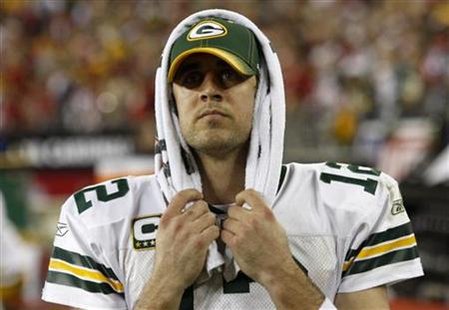 
Green Bay Packers quarterback Aaron Rodgers reacts after his team was defeated by the Arizona Cardinals in overtime of their NFL playoff game in Glendale, Arizona January 10, 2010. REUTERS/Joshua Lott
