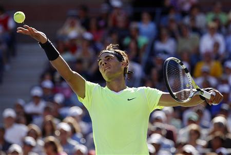 
Rafael Nadal of Spain serves to Gilles Simon of France during the U.S. Open tennis tournament in New York, September 5, 2010. REUTERS/Kevin Lamarque
