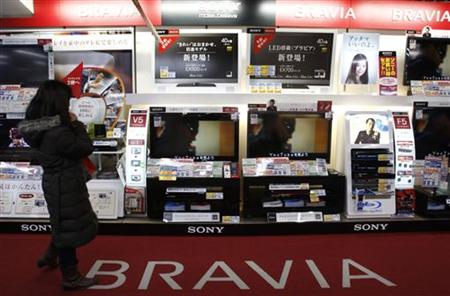 
A woman looks at Sony Corp's Bravia televisions displayed at an electronics store in Tokyo February 4, 2010. REUTERS/Yuriko Nakao
