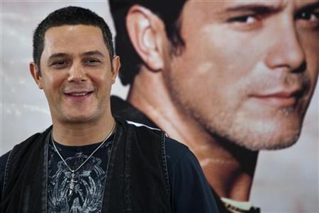 
Spanish singer-songwriter and multiple Latin Grammy Award winner Alejandro Sanz smiles during a media conference to announce his concert "Tour Paraiso 2010" (Paradise Tour 2010) in San Juan August 12, 2010. RUETERS/Ana Martinez
