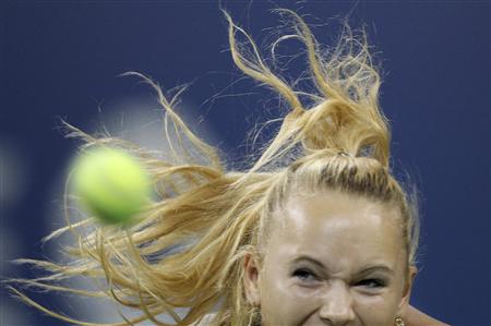 Caroline Wozniacki of Denmark chases down a return to Dominika Cibulkova of Slovakia as a strong wind blows her hair during the U.S. Open tennis tournament in New York September 8, 2010. REUTERS/Mike Segar
Caroline Wozniacki of Denmark chases down a return to Dominika Cibulkova of Slovakia as a strong wind blows her hair during the U.S. Open tennis tournament in New York September 8, 2010. REUTERS/Mike Segar