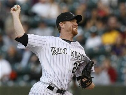 
Colorado Rockies starting pitcher Aaron Cook throws against the New York Mets in the first inning during their MLB baseball game in Denver April 14, 2010. REUTERS/Rick Wilking
