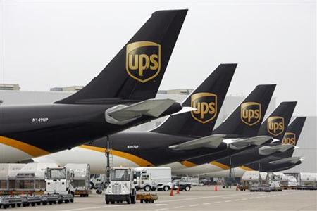 
United Parcel Service aircraft are loaded with air containers full of packages bound for their final destination at the UPS Worldport All Points International Hub during the peak delivery day in Louisville, Kentucky, December 21, 2009. REUTERS/John Sommers II
