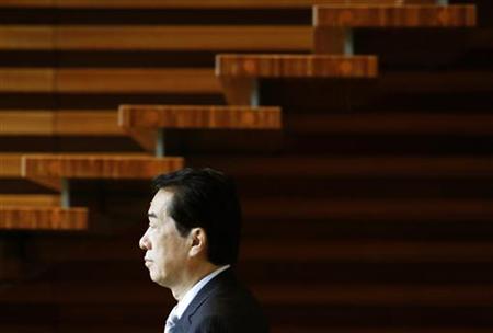 
Japan's Prime Minister Naoto Kan walks past a staircase at his official residence in Tokyo August 30, 2010. REUTERS/Yuriko Nakao
