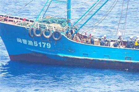 A Chinese fishing boat is inspected by Japan Coast Guard crew members after it collided with two Japanese coast guard vessels near the disputed islands in the East China Sea, known as the Senkaku isles in Japan and Diaoyu in China, September 7, 2010. REUTERS/Japan Coast Guard/Handout
A Chinese fishing boat is inspected by Japan Coast Guard crew members after it collided with two Japanese coast guard vessels near the disputed islands in the East China Sea, known as the Senkaku isles in Japan and Diaoyu in China, September 7, 2010. REUTERS/Japan Coast Guard/Handout